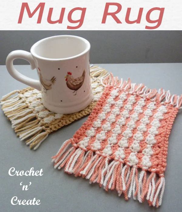 Free crochet mug rug pattern, this easy designs is finished with pretty fringed ends. CLICK and scroll down the page for the pattern. | #crochetmugrug #crochetcoaster #crochetmat #crochetdining #crochetforthehome #crochetmat #crochet #crochetncreate #crochetpattern #freecrochetpattern #easypattern #freepattern #forbeginners #diy #crafts #crochetaddict #followforcrochet