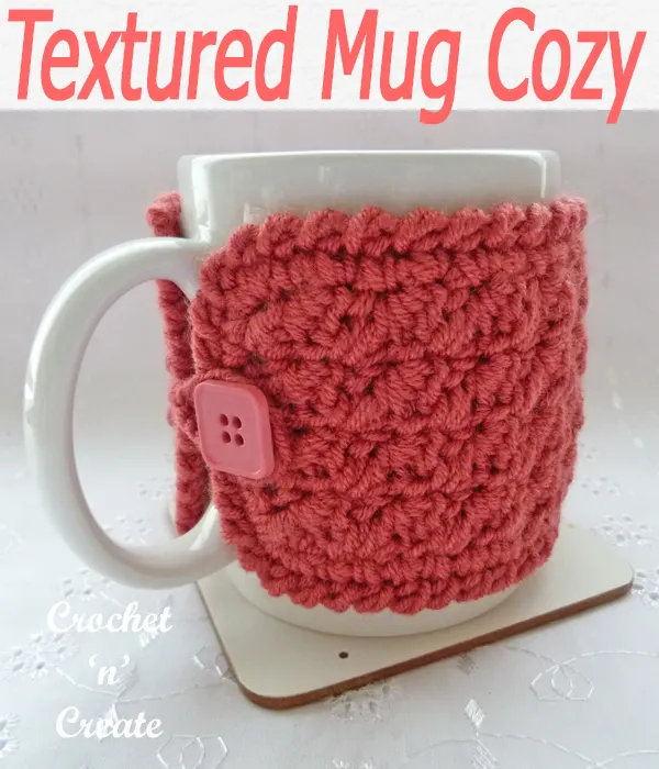 Textured stitch mug cozie, a free crochet pattern, crochets up really quickly and is great to sell at craft fayres etc. CLICK and scroll down the page for the pattern. | #crochetforthehome #crochetmugwarmer #crochetmugcozy #crochetncreate #crochet #crochetpattern #freecrochetpattern #easypattern #freepattern #forbeginners #diy #crafts #crochetaddict #followforcrochet