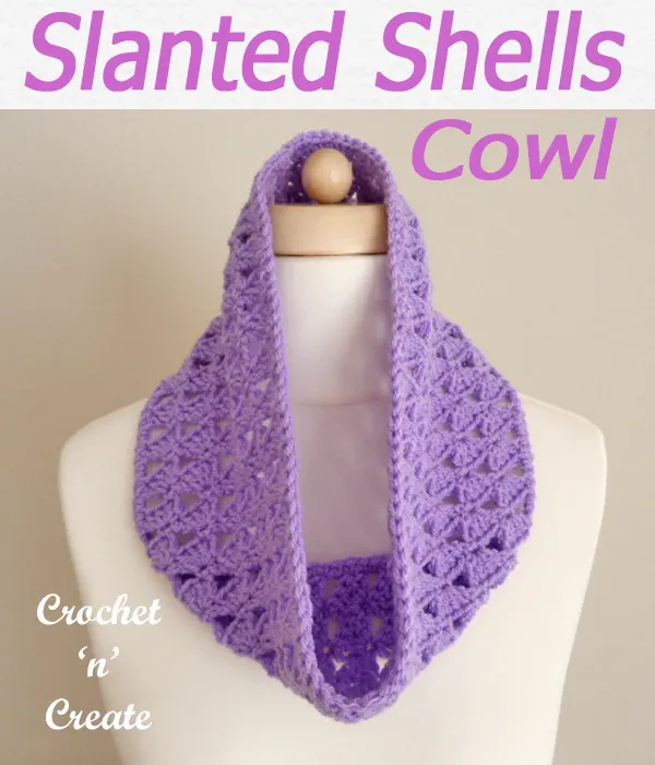 This free slanting shells cowl crochet pattern is made in light worsted yarn and is a lovely alternative for a scarf. CLICK and scroll down the page for the pattern. | #crochetcowl #crochetscarf #scarf #crochet #howto #crochetpattern #freecrochetpattern #easypattern #freepattern #forbeginners #diy #crafts #crochetaddict #followforcrochet