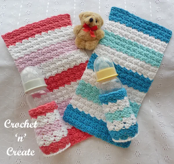 two baby burp cloths and bottle covers