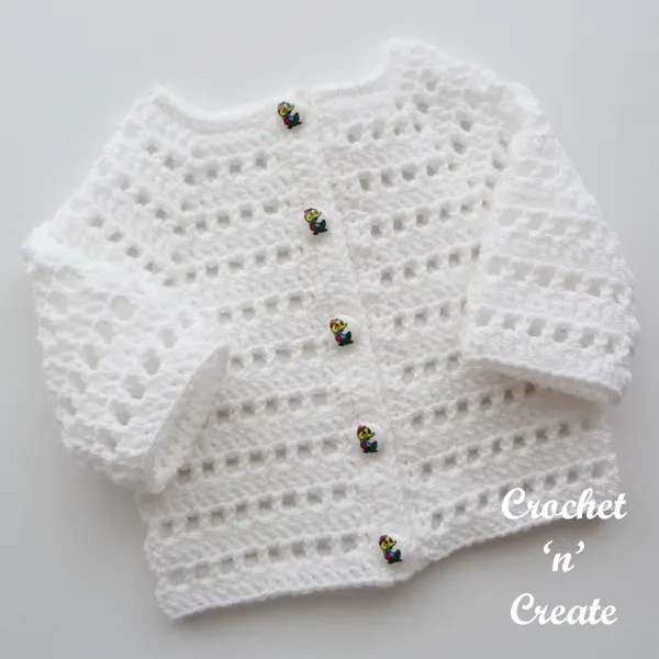 white infant sweater