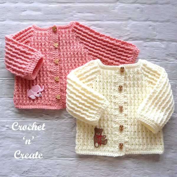 two infant sweaters