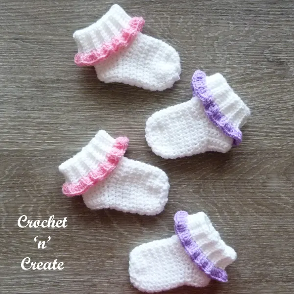 two pairs infant feet covers